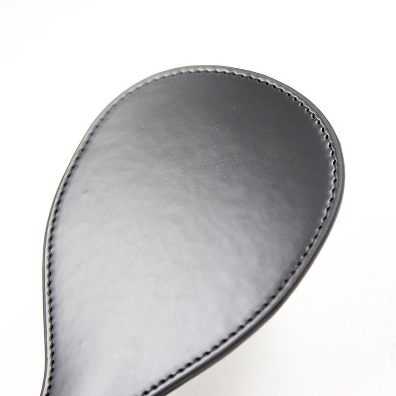 Bred paddle spanker med rem - sort
