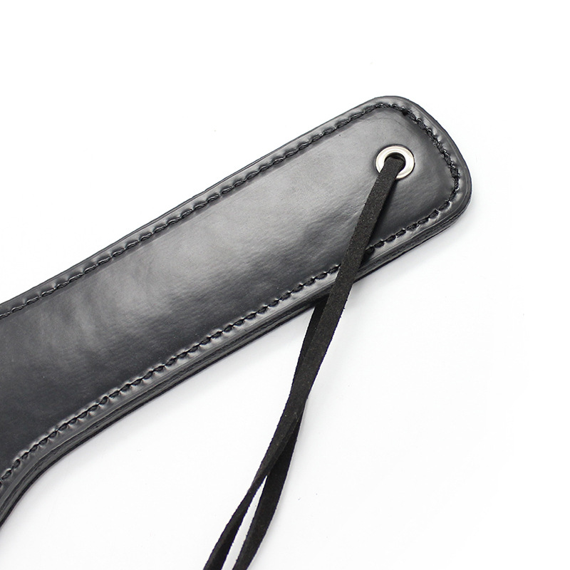 Bred paddle spanker med rem - sort