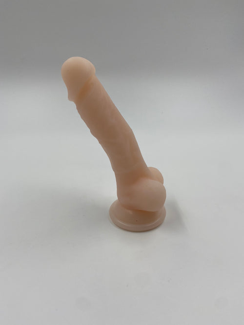 Blød dildo med kugler og sugekop.